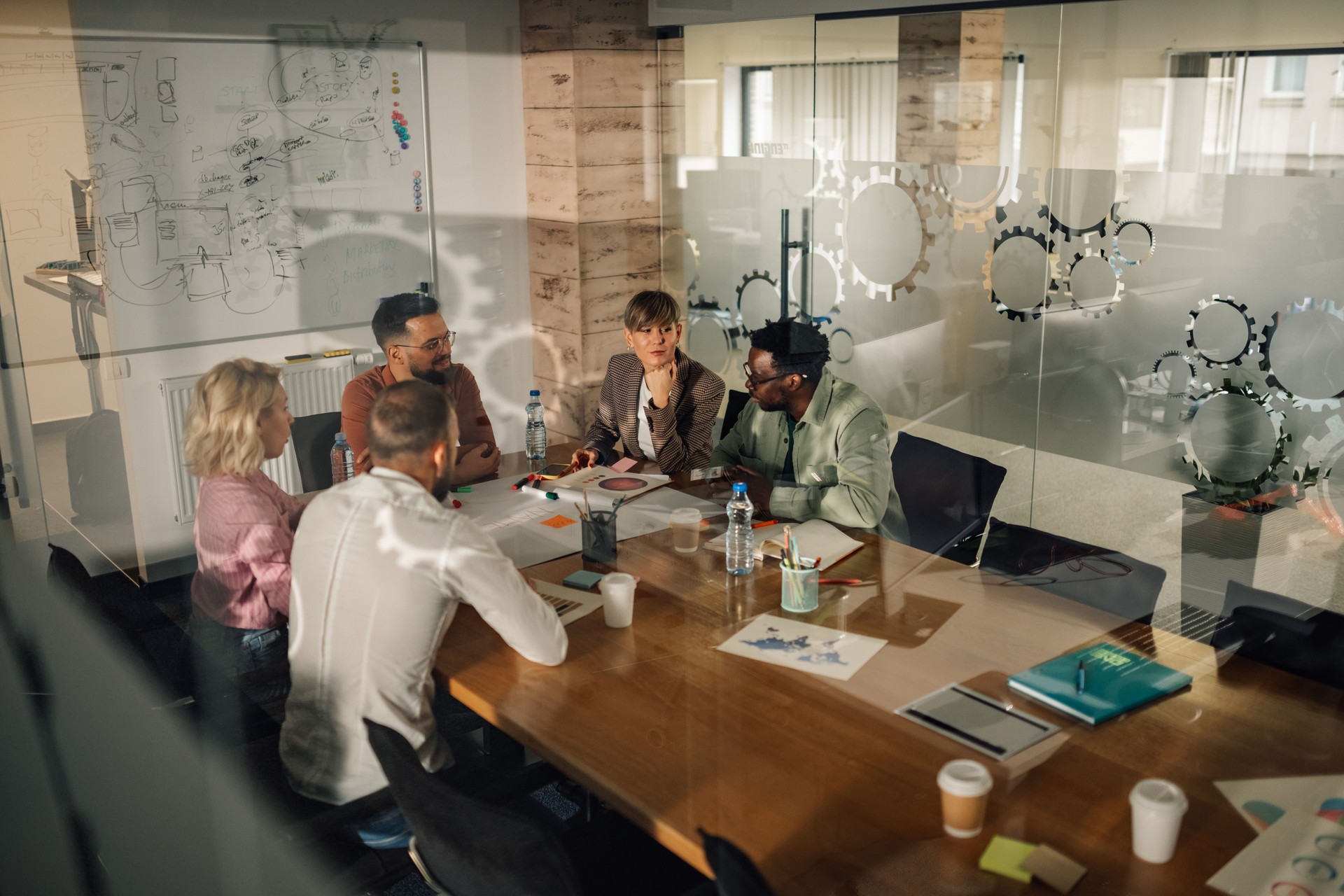 Business team discussing strategy during meeting in modern office